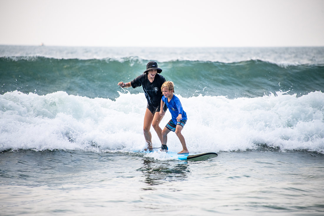 young surfers practicing stance