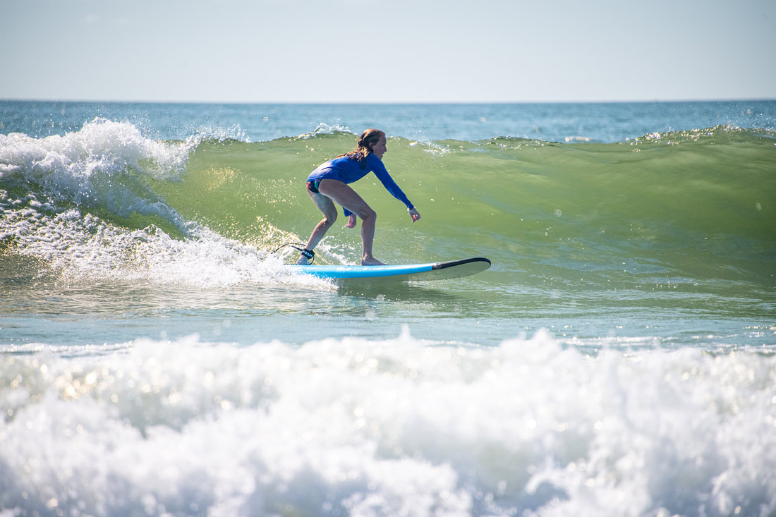 young girl surfing