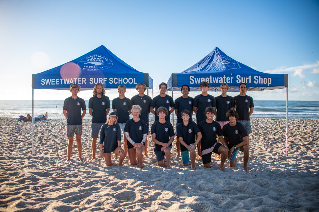 Sweetwater Surf instructors smiling with class